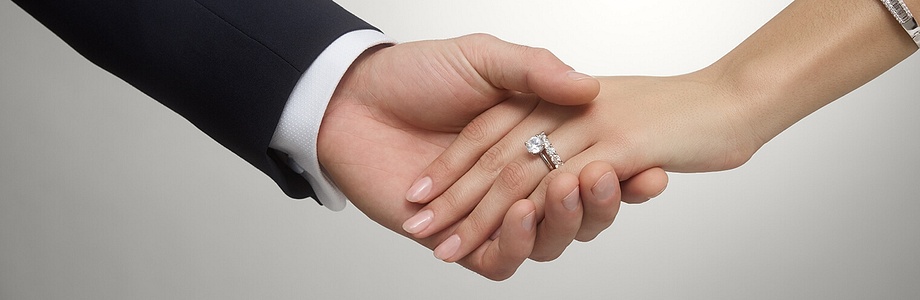 bride and groom holding hands